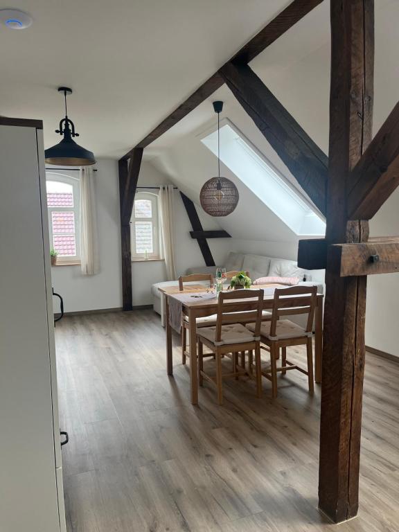 a dining room with a table and chairs at Haus Wally - Ferienwohnungen in Klitten