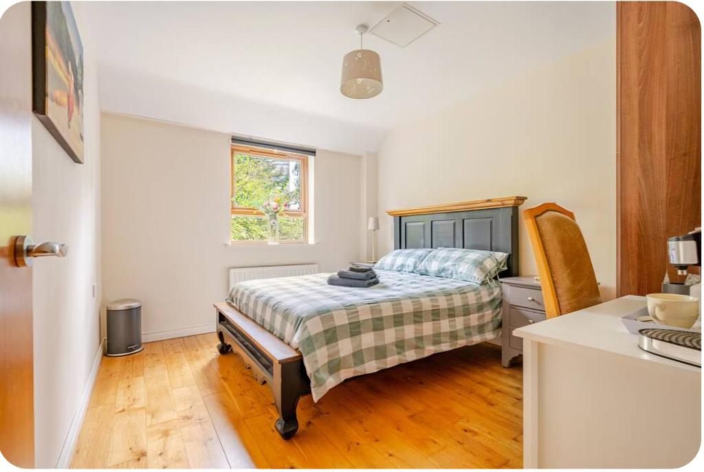 a small bedroom with a bed and a window at Sequoia Tree in Belfast