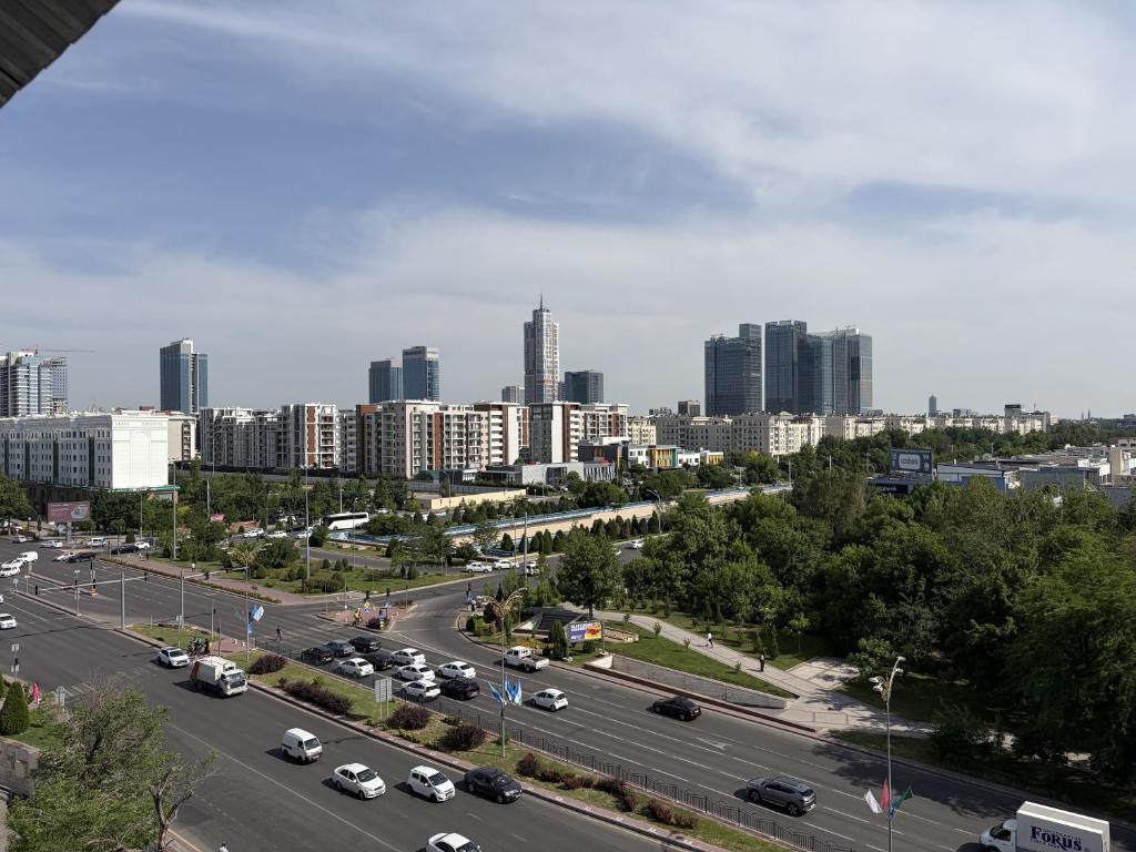 a highway in a city with cars on the road at Tashkent City View Apartments in Tashkent