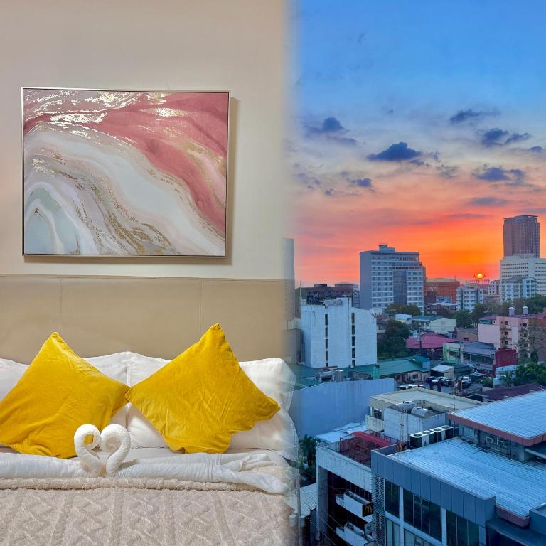 a white couch with yellow pillows on top of a building at Corner Studio in Ermita Manila near US Embassy and SLMEC in Manila