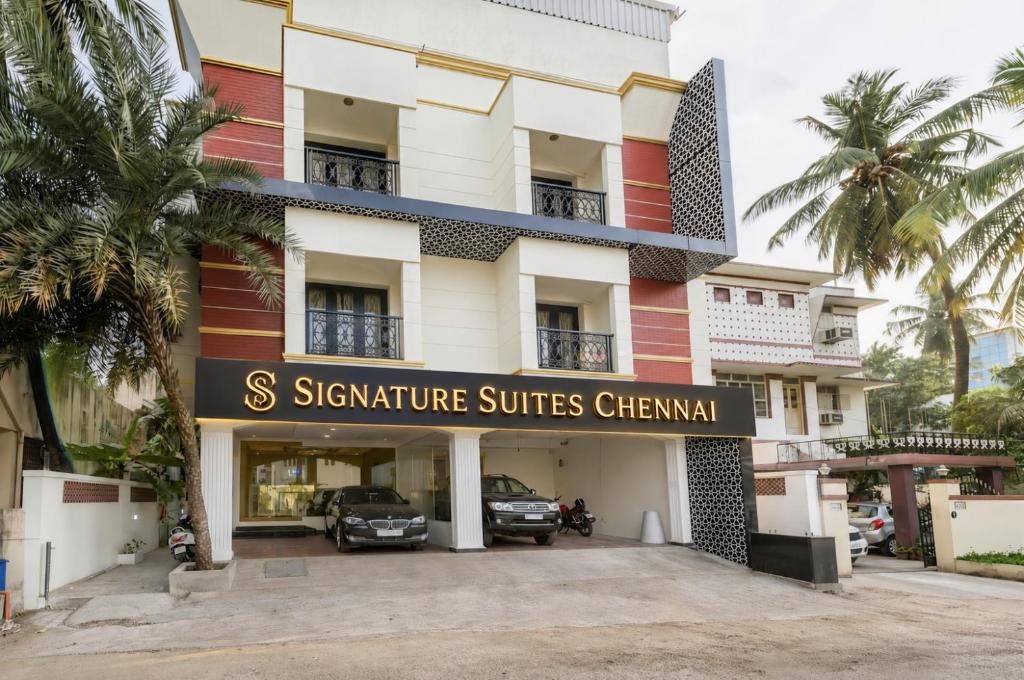 a building with a sign that reads s signature suites chewan at Signature Suites Chennai in Chennai