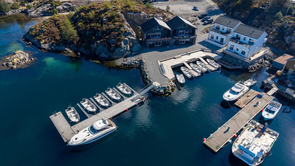 an aerial view of a marina with boats in the water at Eksklusiv Rorbu - Havblikk 1 - Båtutleie in Bekkjarvik