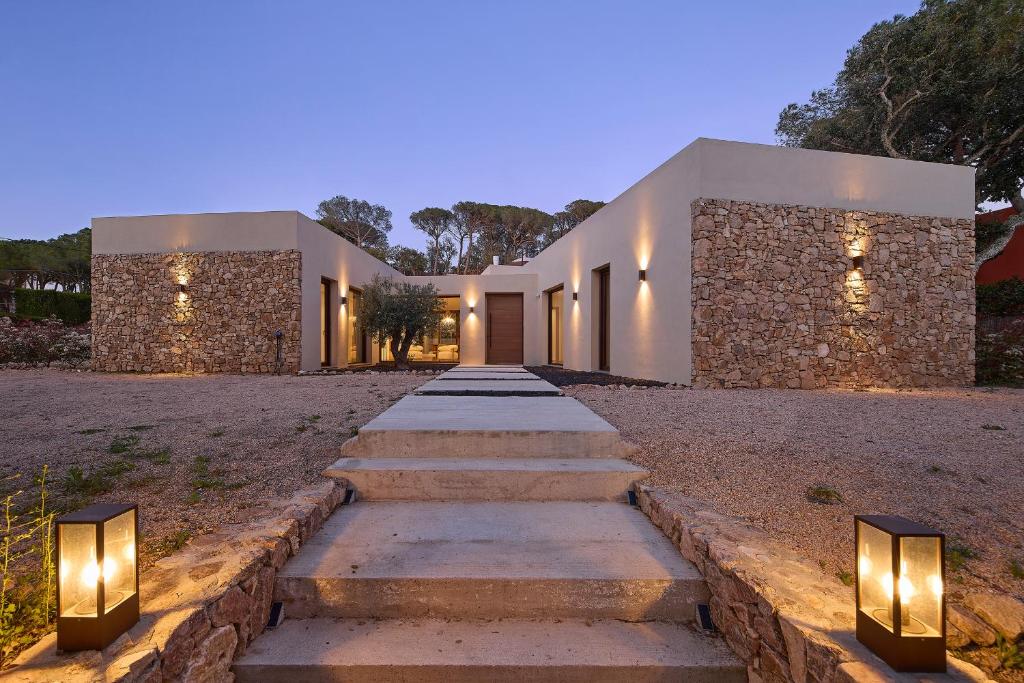 a pathway leading to a house with lights at Villa Calella Brava in Calella de Palafrugell