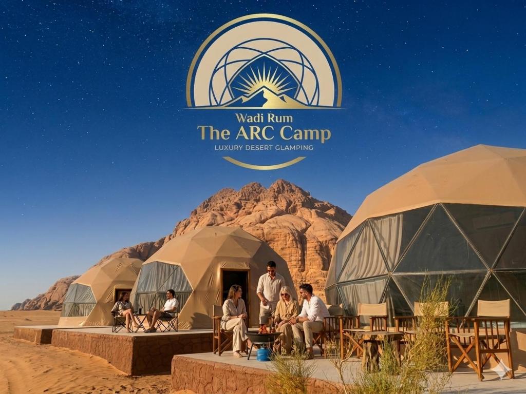 a group of people sitting in domes in the desert at Wadi Rum The ARC camp in Wadi Rum