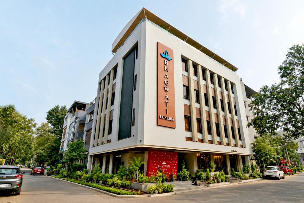a building with a sign on the side of it at Bhagwati luxuria in Indore