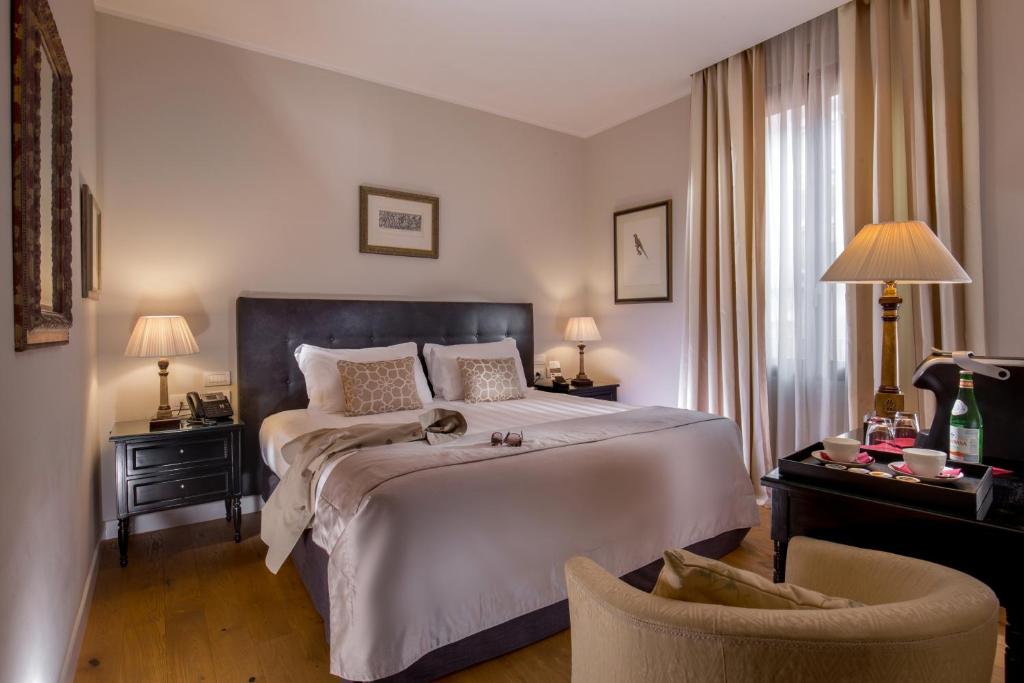 Postel nebo postele na pokoji v ubytování Hotel Monte Cenci