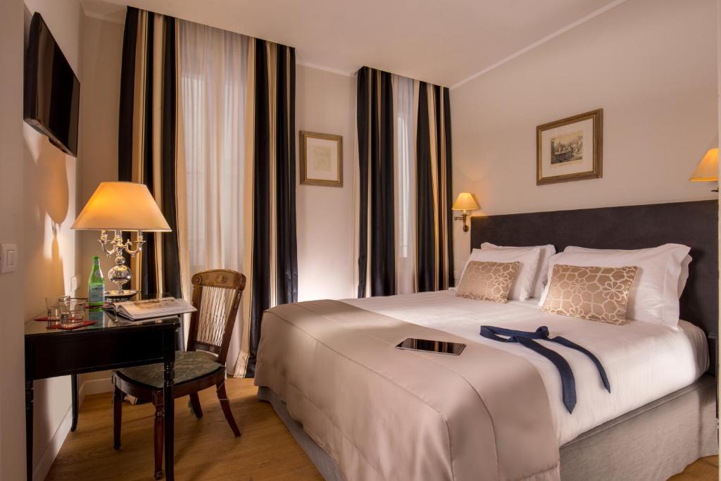 Postel nebo postele na pokoji v ubytování Hotel Monte Cenci