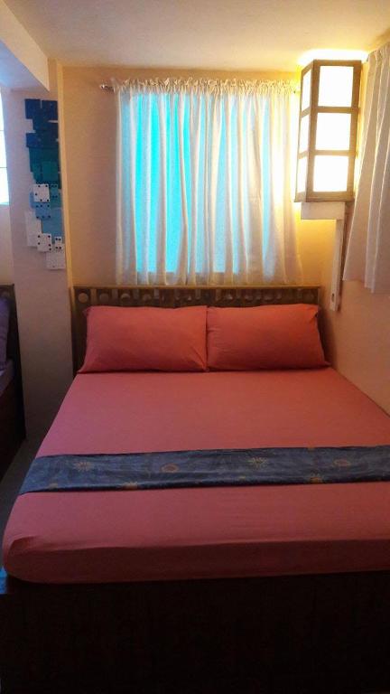 Postel nebo postele na pokoji v ubytování Gomez Guest House