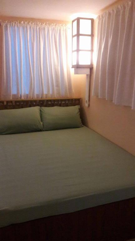 Postel nebo postele na pokoji v ubytování Gomez Guest House