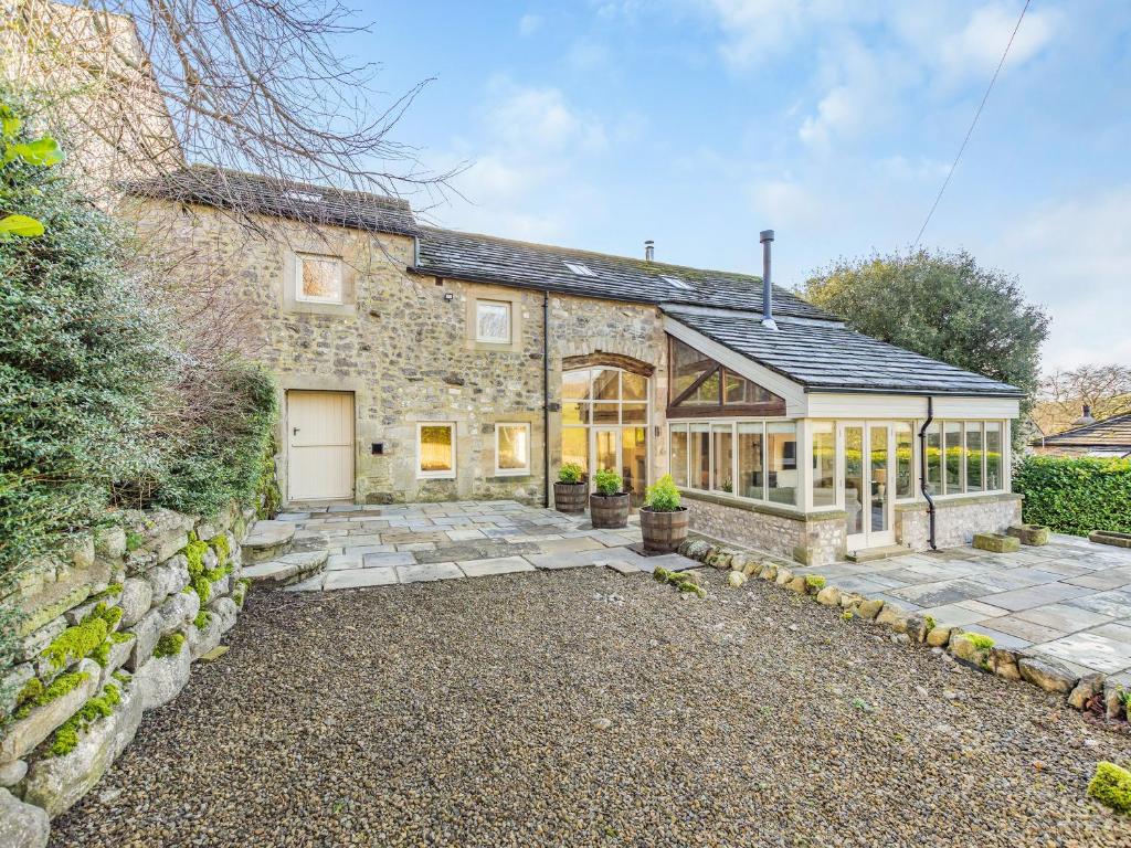 an exterior view of a stone house at Badger Hill Barn in Malham