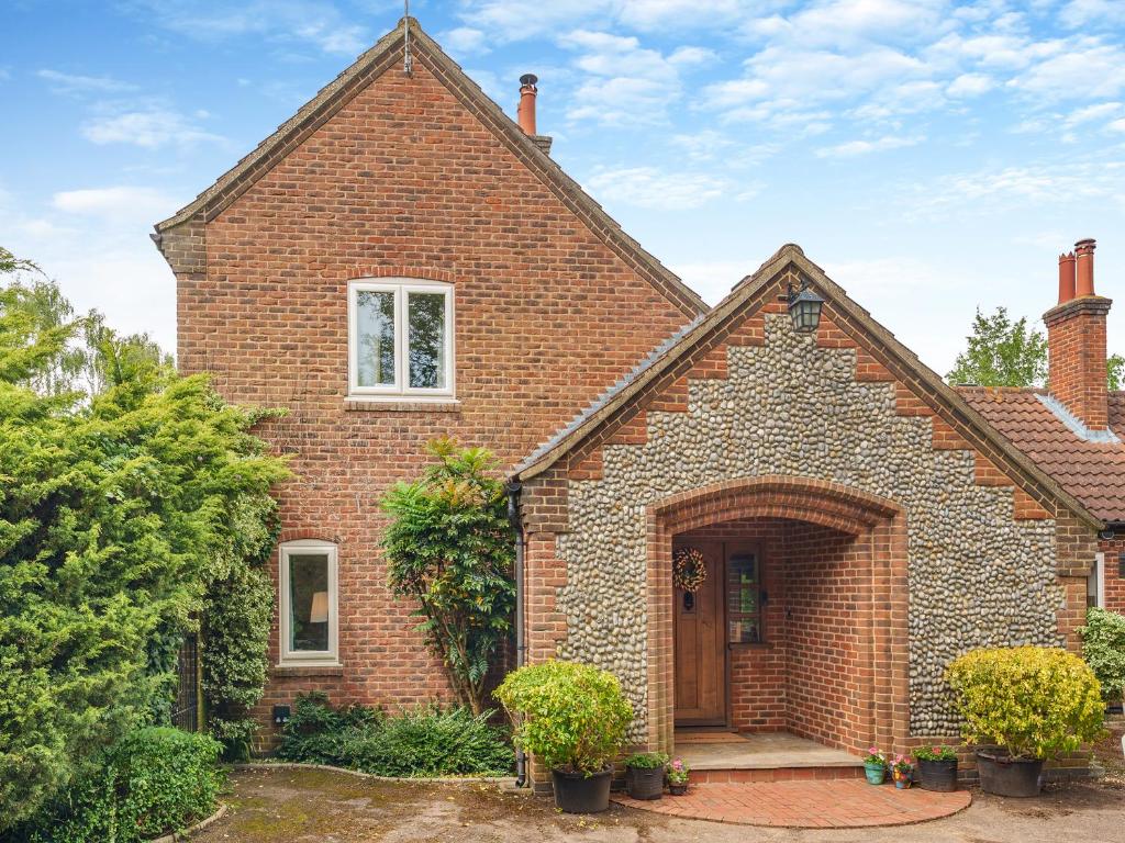 an old brick house with a large door at Cranny Hill in Walpole
