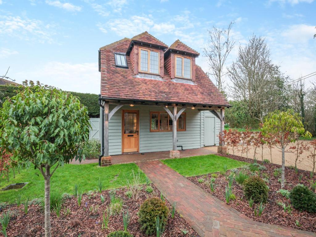 a small white house with a red roof at Keeds Barn in Arundel