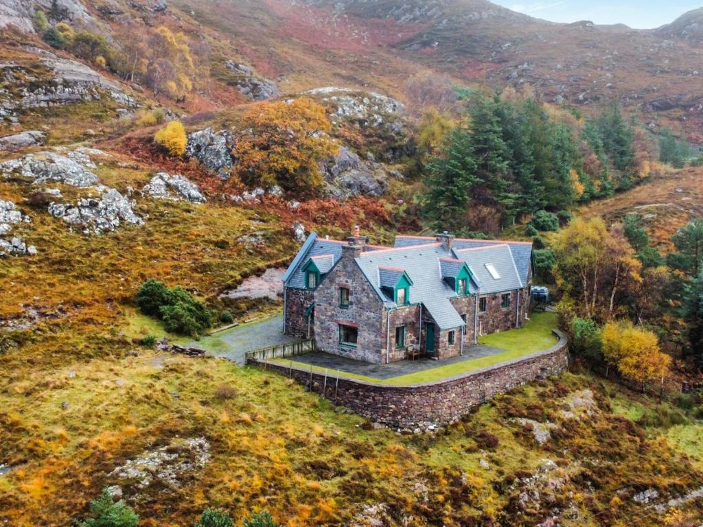 an aerial view of a house on a hill at Rubha Lodge in Shieldaig
