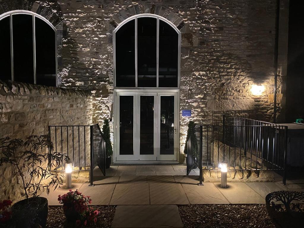 a front door of a house at night with lights at The Richmond - Uk40459 in Newsham