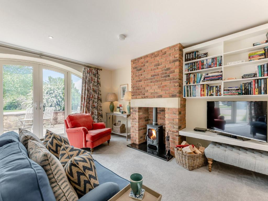 a living room with a couch and a fireplace at Nightfold - Uk49890 in Preston