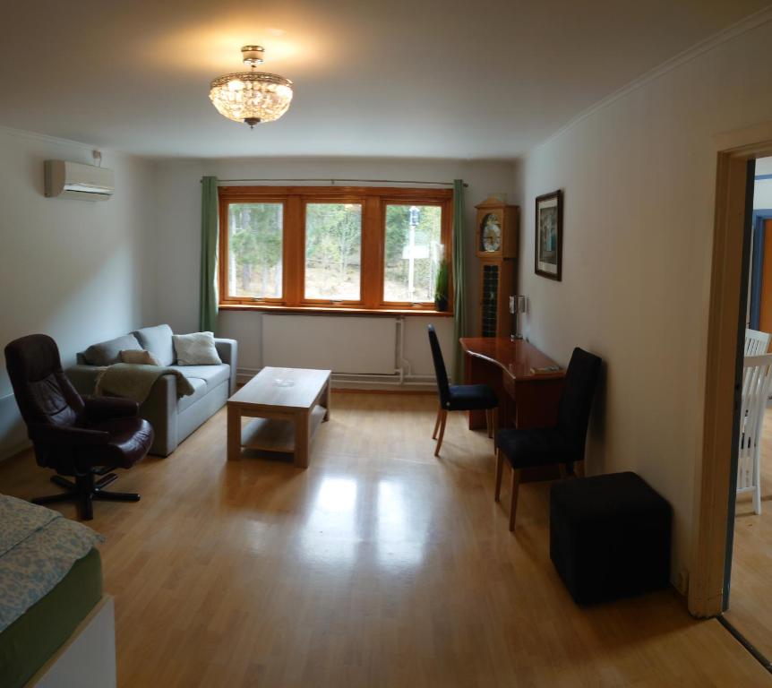 a living room with a couch and a table at Two bedroom Apartment 80m2 2nd floor in Bagn