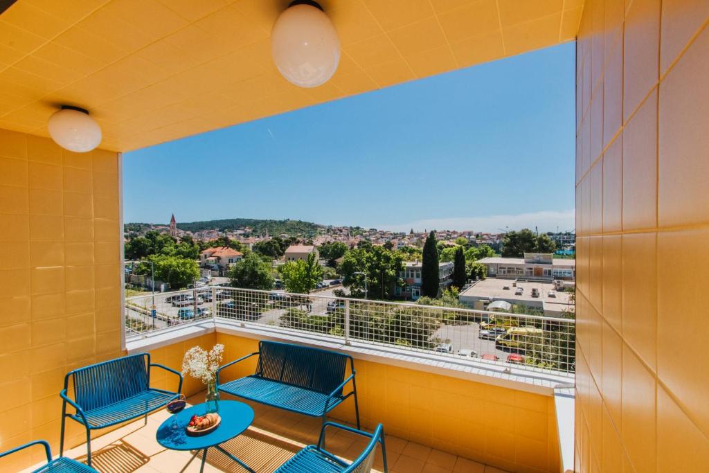 a balcony with a view of the city at áPero Suites in Trogir