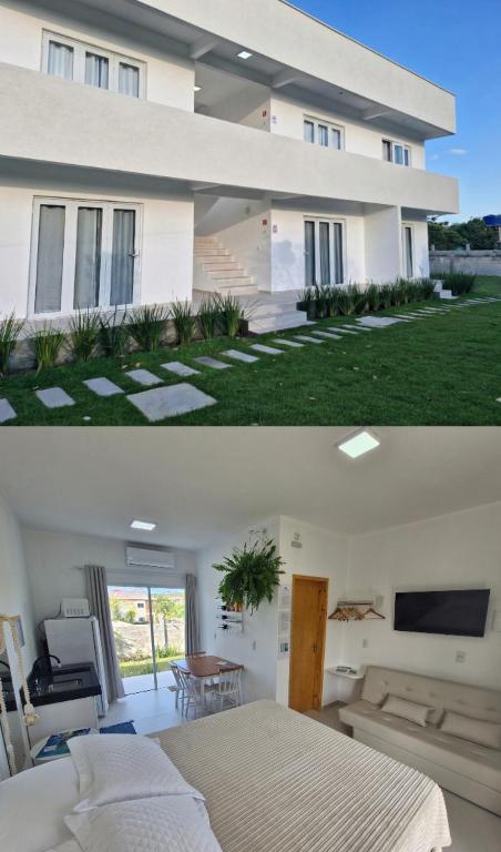 a large white house with a bed in front of it at Palo Santo - Praia do Rosa in Praia do Rosa