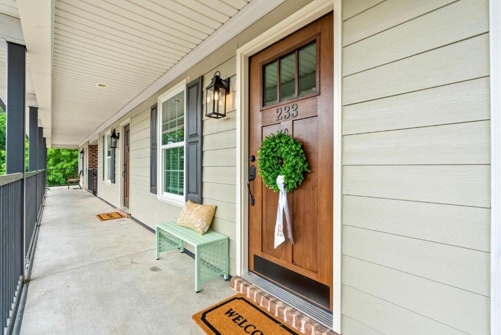 a front door of a house with a wreath on it at Roaring On Ross In Auburn in Auburn