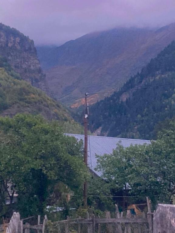 a view of a mountain with a church in the foreground at noras guesthauze 2026 in Zhabeshi