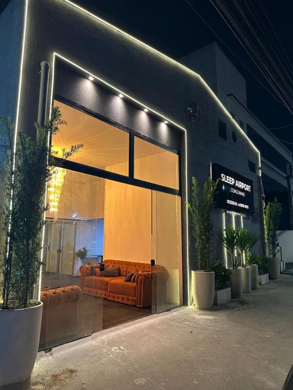 a store front with a couch inside of it at sleep airport congonhas in São Paulo