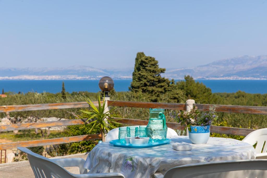 a table with a bottle of water on it at Holiday Home Grubišić in Mirce