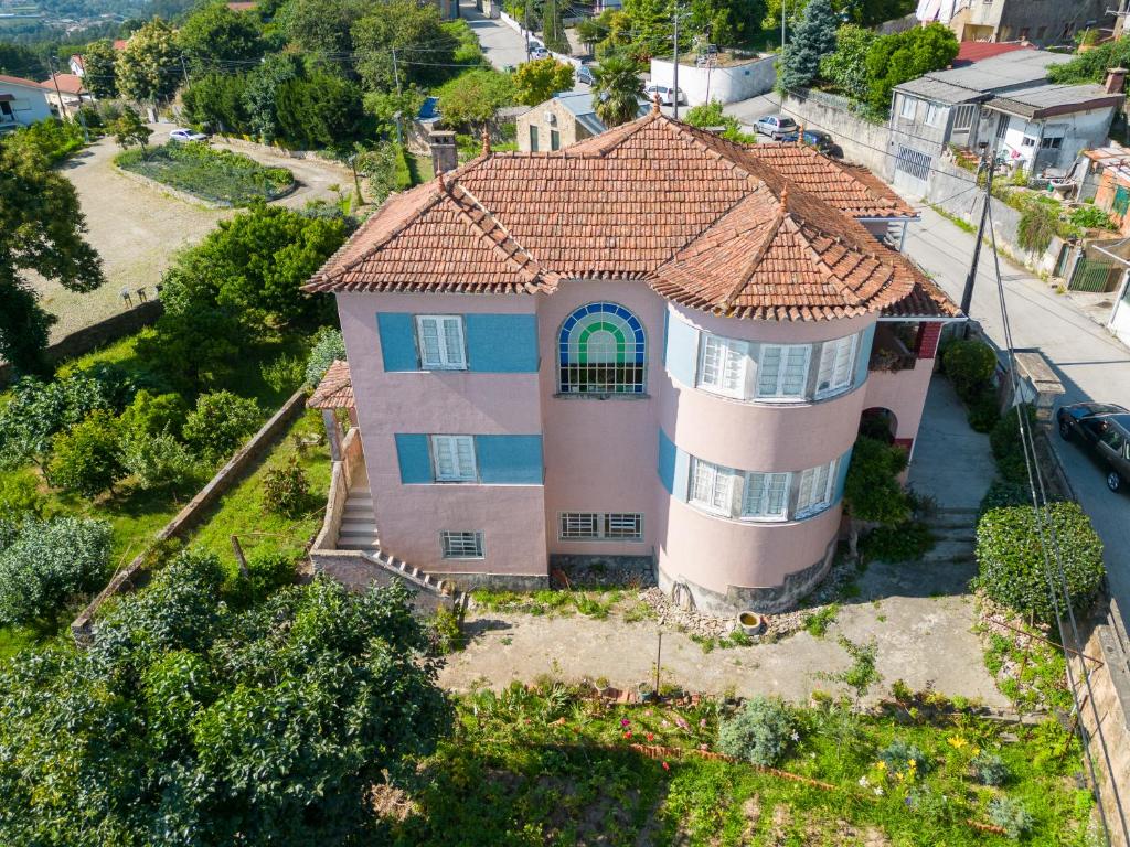 an aerial view of a house with a tile roof at Pink-Shell in Santiago de Riba-Ul