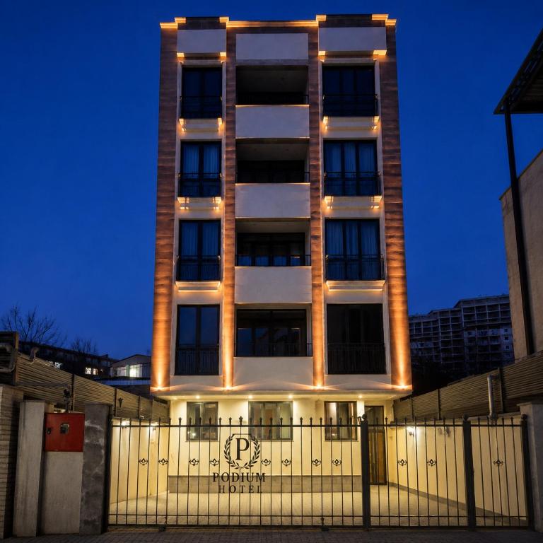 a tall building with lights on the side of it at Podium Boutique Hotel in Yerevan
