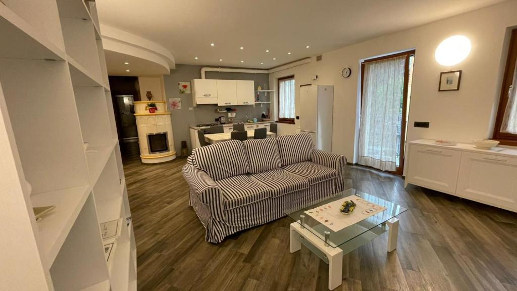 a living room with a couch and a table at Appartamenti Bion in Levico Terme