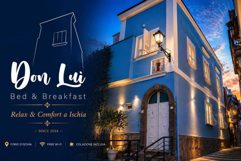 a blue building with a white door and a street at B&B Don Luì in Forio d'Ischia