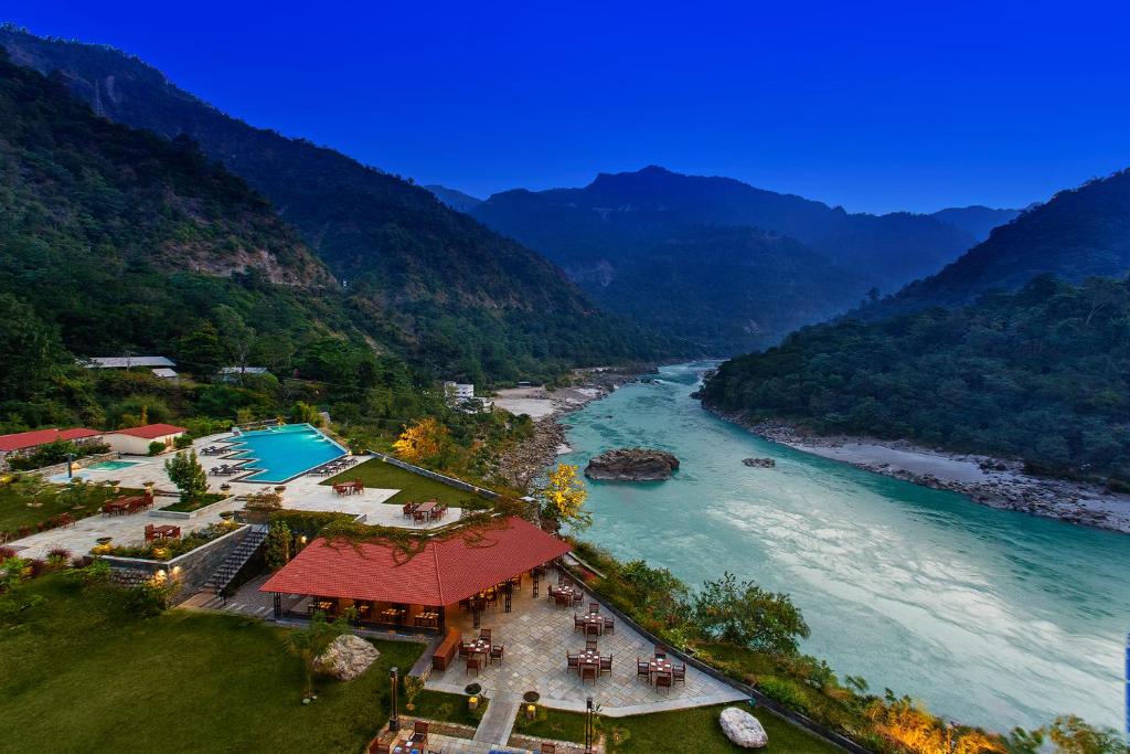 an aerial view of a river with mountains at Aloha On The Ganges by Leisure Hotels in Rishīkesh