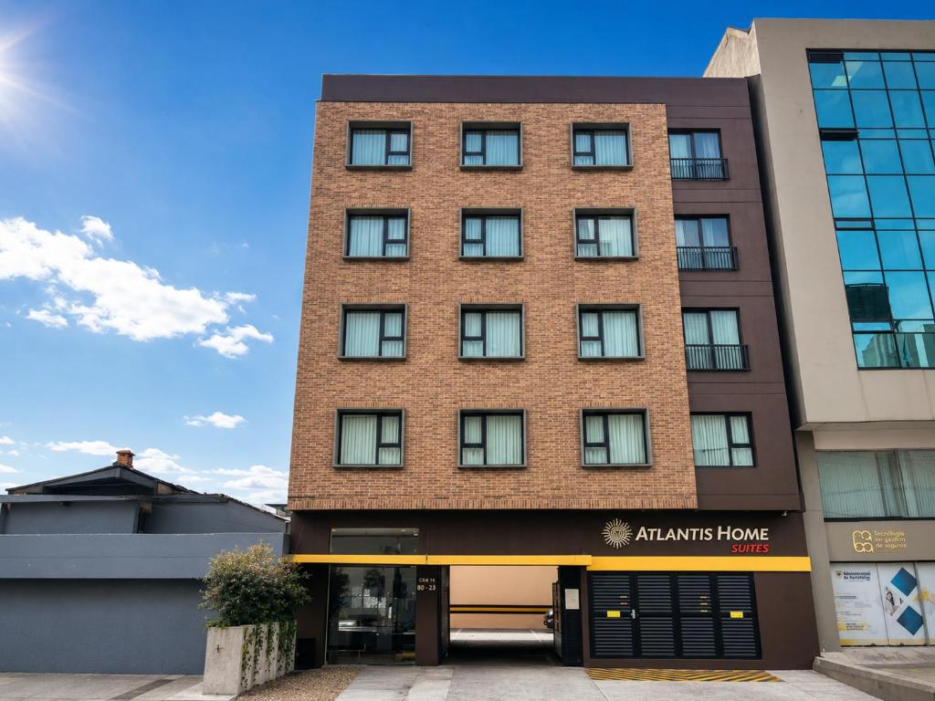 an apartment building with a brick facade at Atlantis Home Suites Zona T in Bogotá