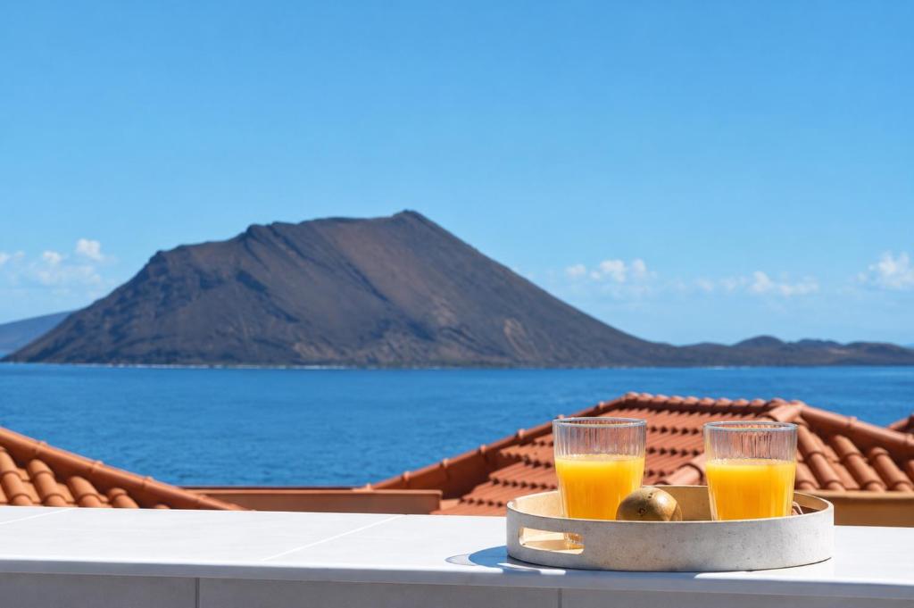 two glasses of orange juice on a tray on a table at La Casa del Toro in Corralejo