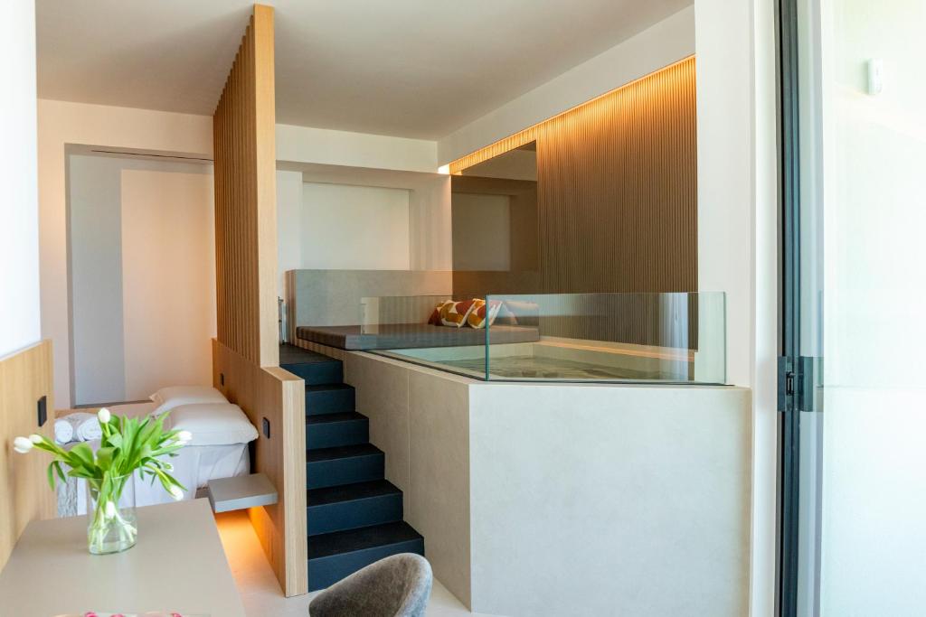 a staircase leading to the kitchen of a house at Terradamare Suites in Monopoli