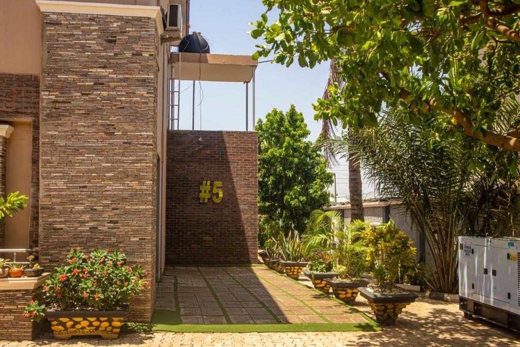a brick wall with the number on it at #5 Apartment in Parma