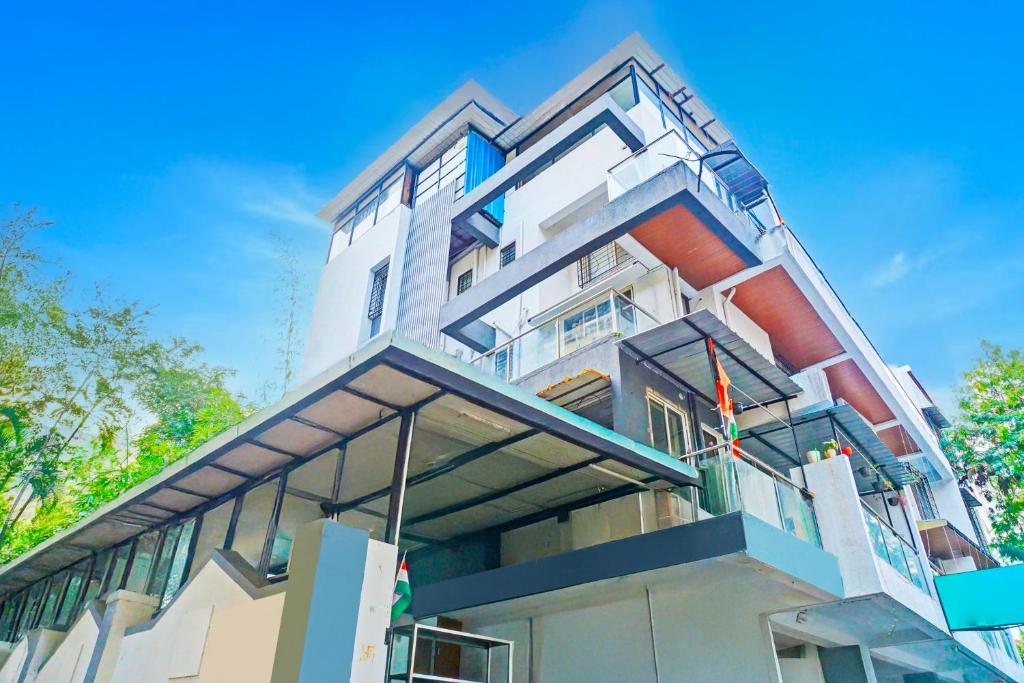 a building with balconies on the side of it at Super Collection O Baner Formerly Seven Hills in Pune