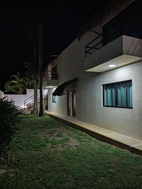 a night view of a building at night at Miriam Lofts in Bacalar