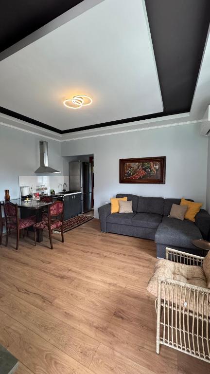 a living room with a couch and a table at Αρχοντικό Κάτω Βρύση in Levidi