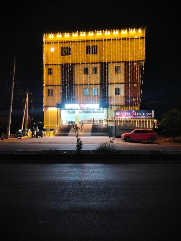 a building with lights on top of it at night at Hotel N Pride in Guntūr