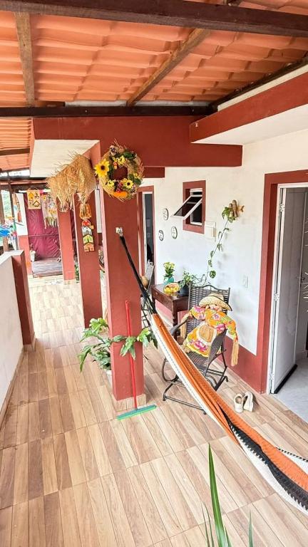 a living room with a hammock in a house at Casa Bananeiras Azul in Bananeiras