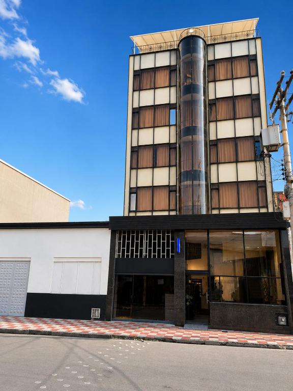 a building on a street in front of a building at Hotel Ejecutivo 63 In in Bogotá