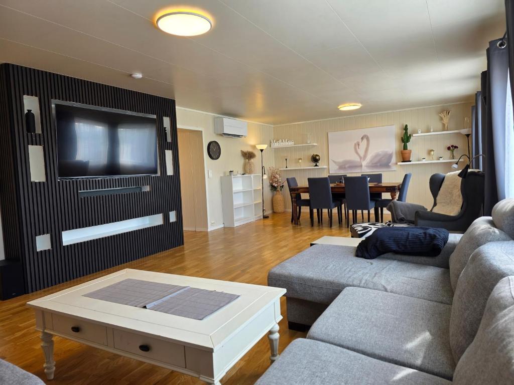 a living room with a couch and a table at T&T Vardø in Vardø