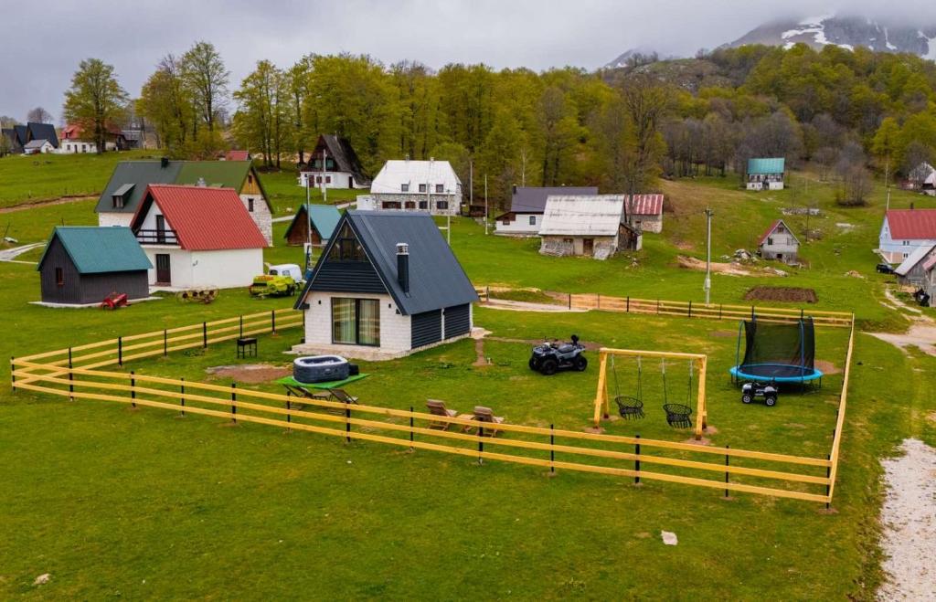 an aerial view of a village with a playground at Zov planine in Žabljak