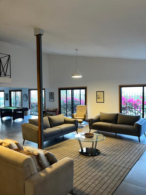 a large living room with couches and a table at Chez Diarra in Saint-Louis