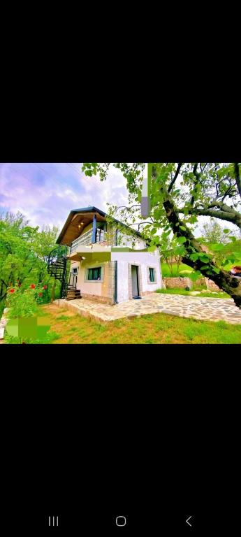 a house is shown in a collage of photos at Galaluxe in Tʼeghut