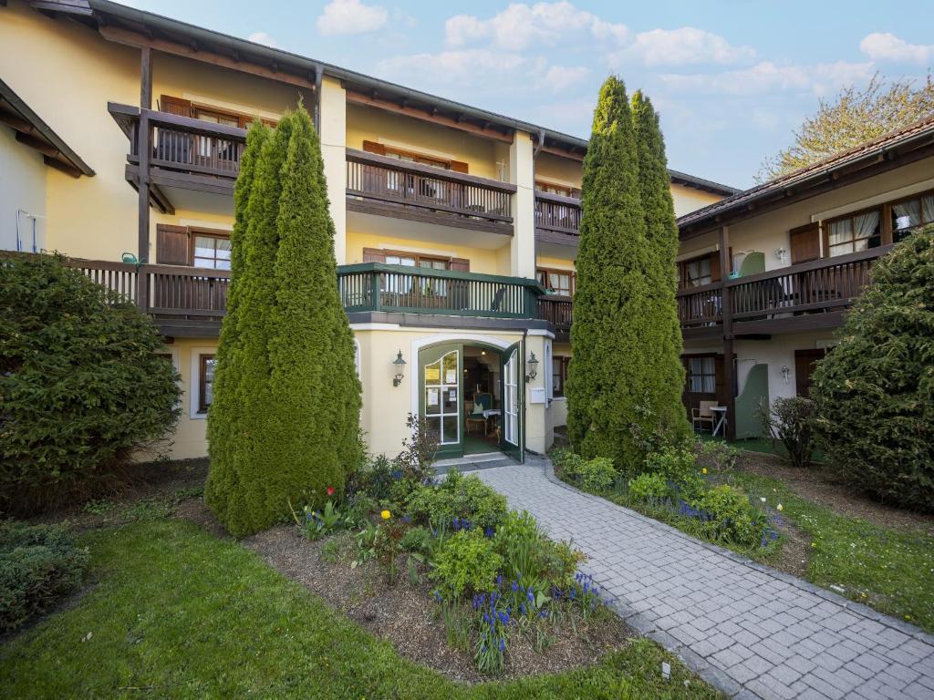 a building with trees in front of it at Geräumiges Studio in Bad Birnbach in Bad Birnbach