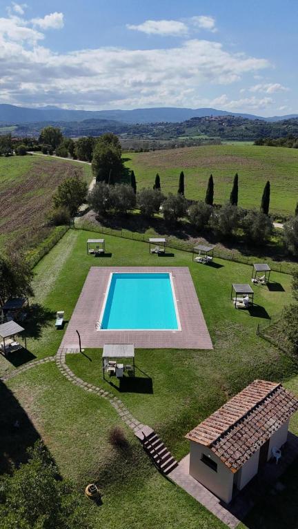an overhead view of a swimming pool in a field at Le Palazze B&b in Chiusi