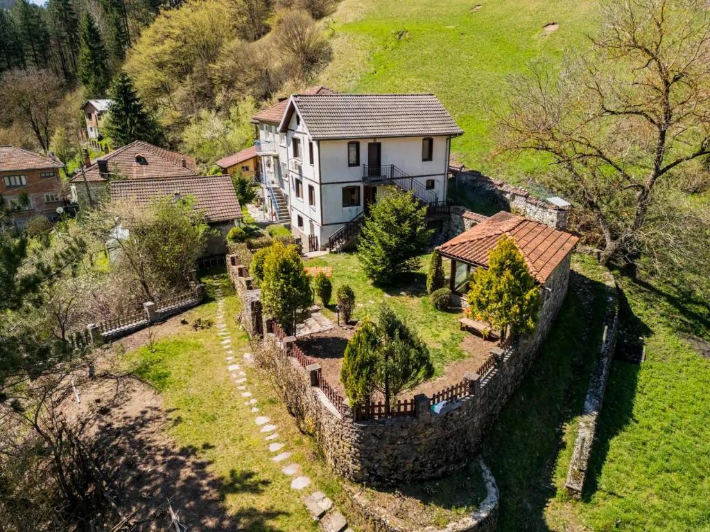 an aerial view of a house with a stone wall at Вила Соколето in Sokolovtsi