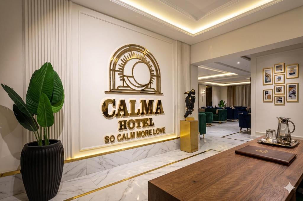 a lobby with a hotel sign on the wall at Calmaa Kairo in Cairo