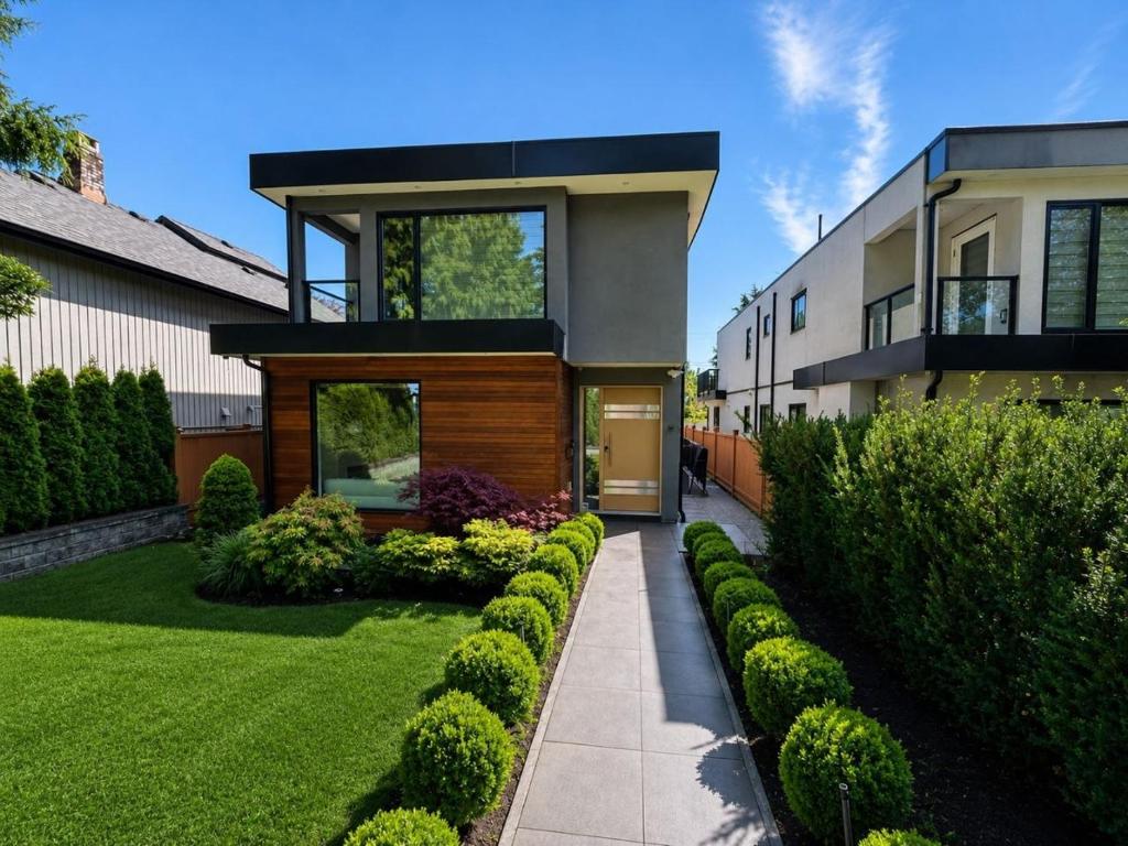 a house with a walkway in front of a yard at A&A Resident - Modern North Vancouver 2BR Suite in North Vancouver